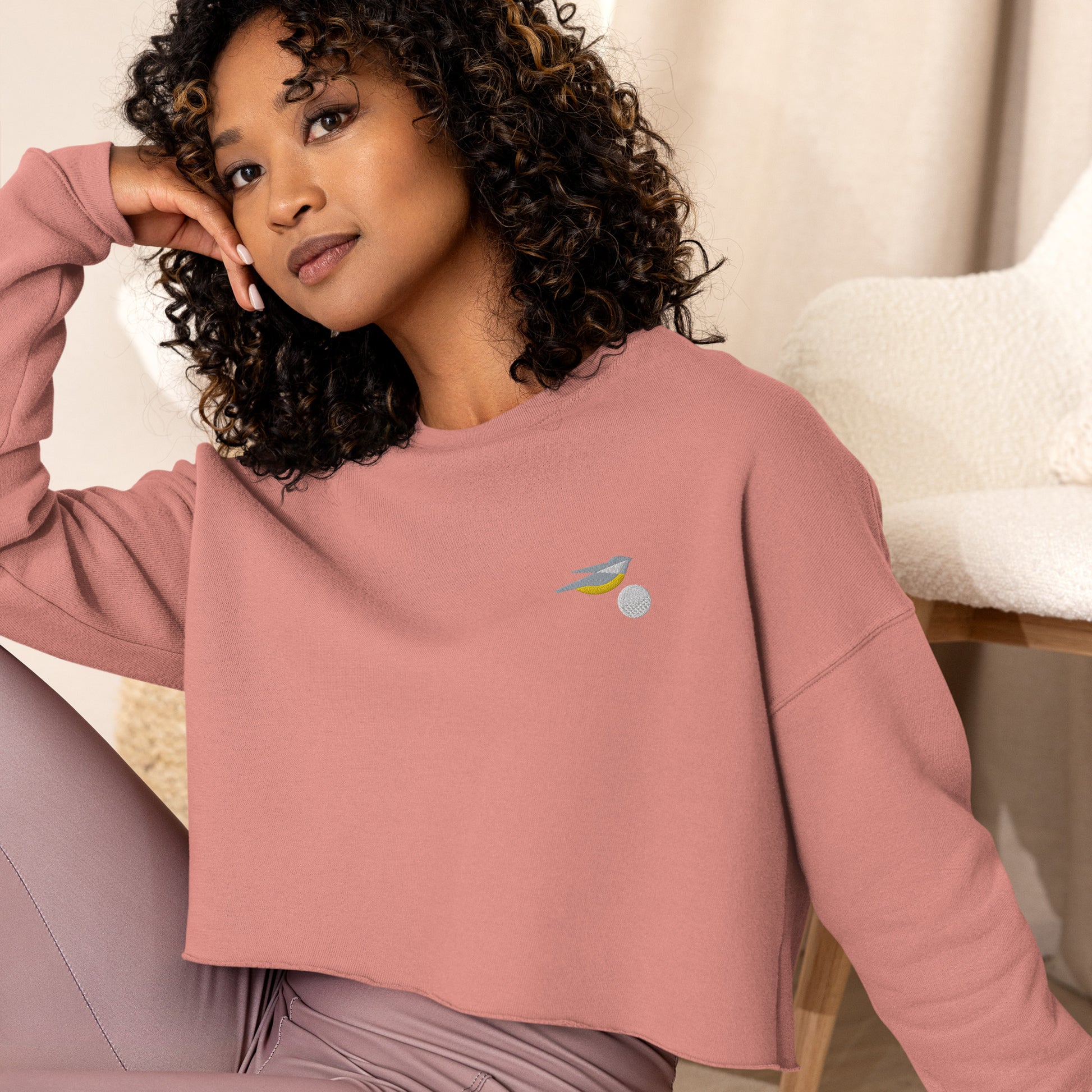 Womens cropped sweatshirt in pink with embroidered birdie and ball design